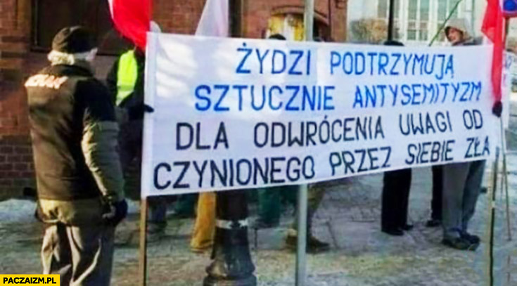 Żydzi podtrzymują sztucznie antysemityzm dla odwrócenia uwagi od czynionego przez siebie zła napis transparent